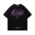 Man wearing a black retro graphic print cotton t-shirt with a loose fit and short sleeves.