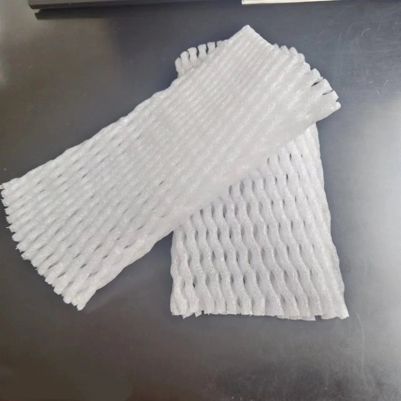 White foam fruit net protective cover for produce cushioning and shockproof packaging