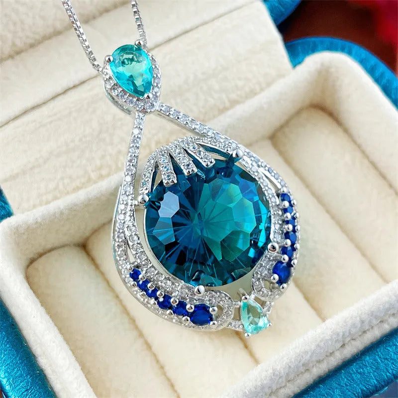 Blue fireworks-cut gem geometric pendant necklace on water wave chain for women