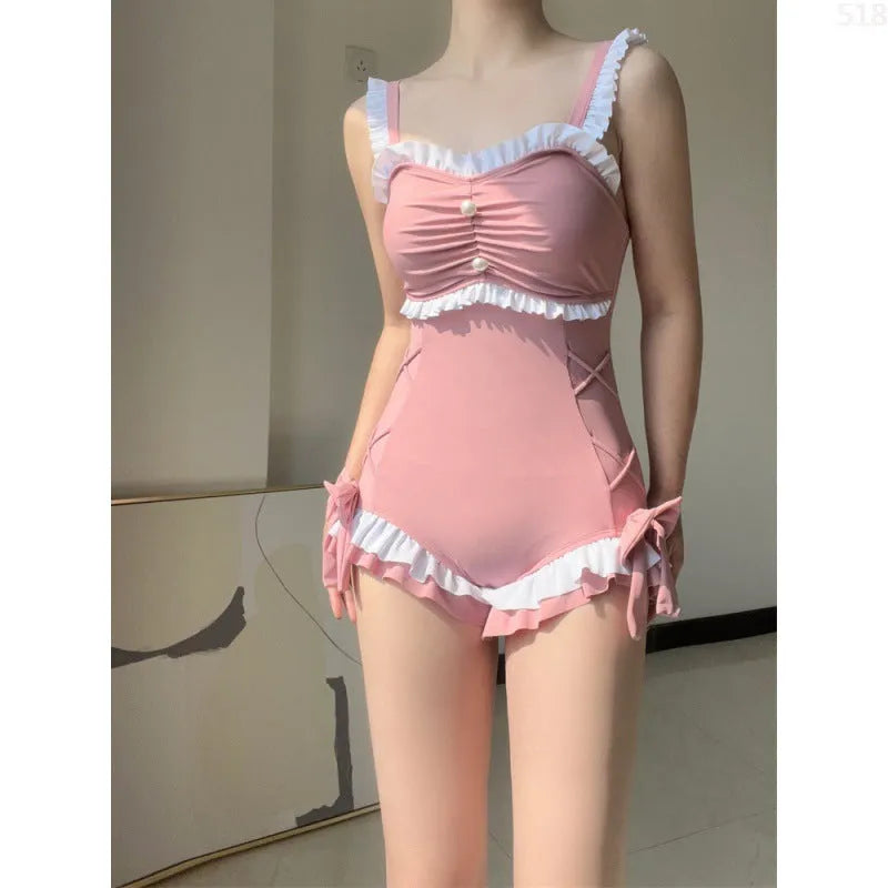 Women's one-piece milk silk swimsuit in solid pink colour with sleeveless design