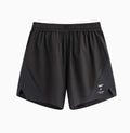 Black running shorts with laser stitching detail on a grey background.