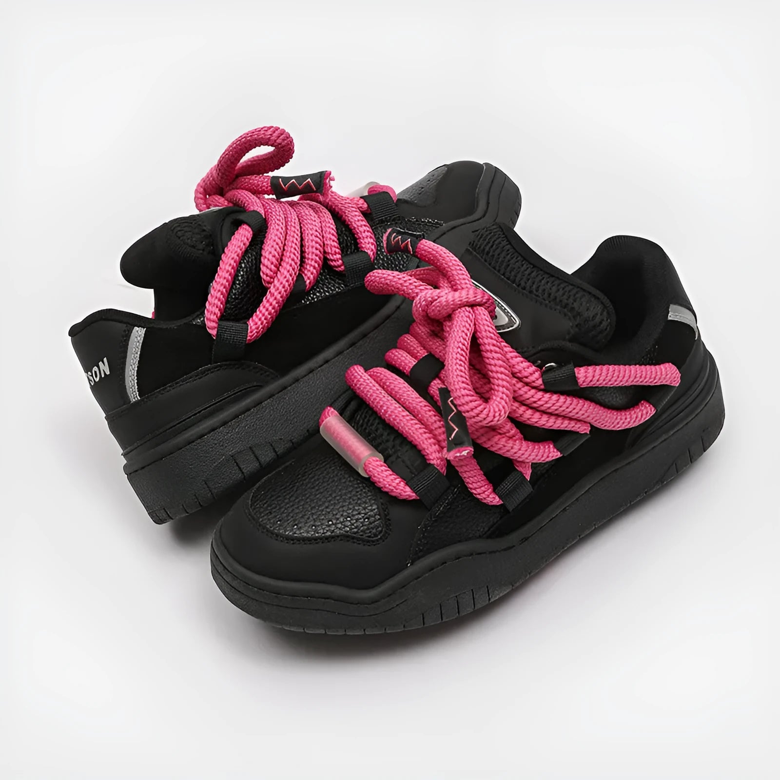 A pair of low-top unisex casual shoes with a round toe, thick rubber sole, and lace-up front on a white background.