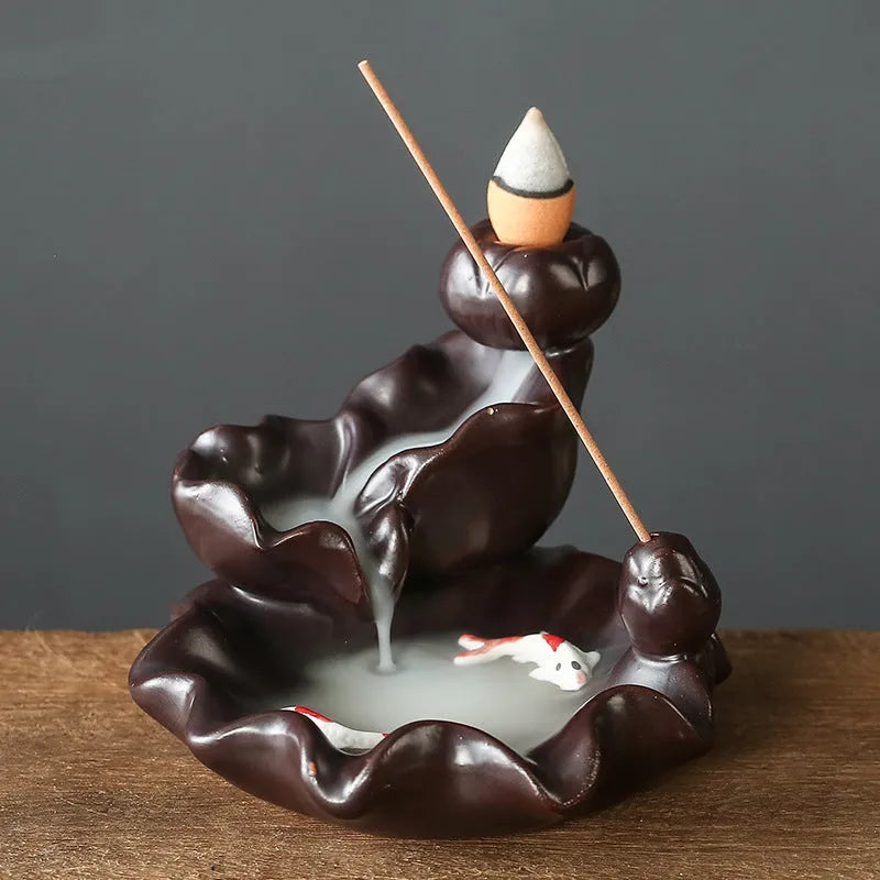 Creative ceramic backflow incense burner ornament in modern simplicity style with smoke cascading downwards