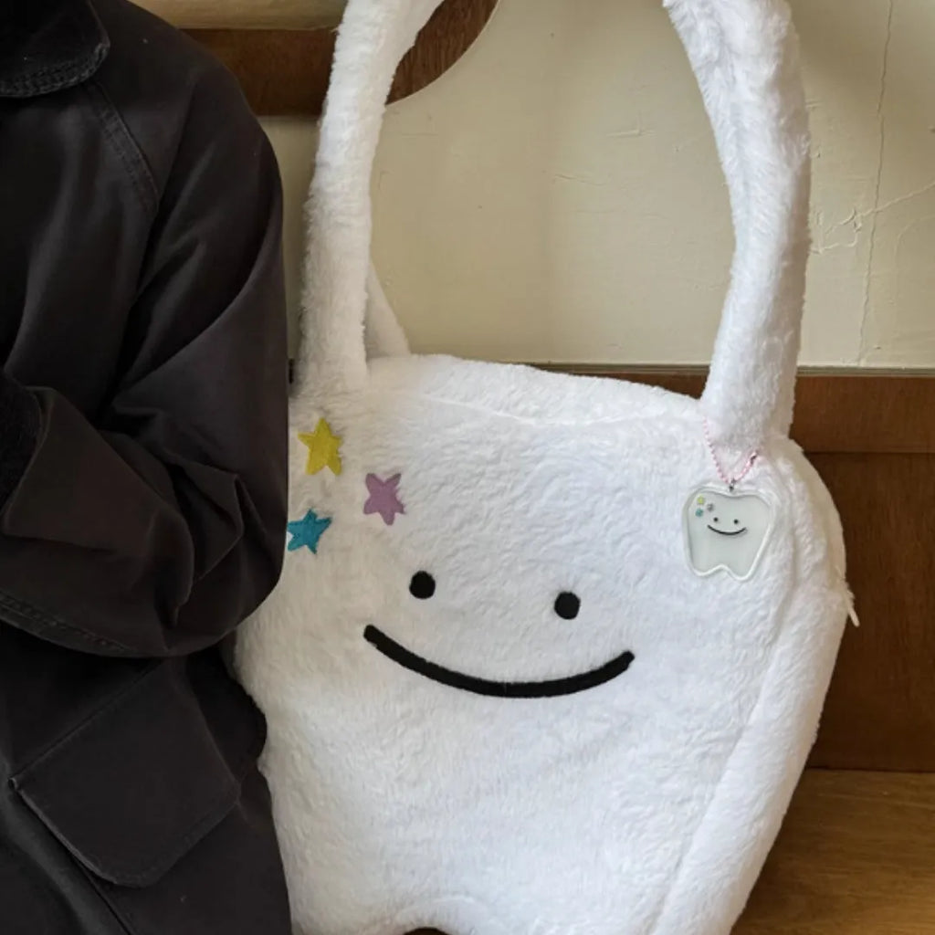 White plush shoulder tote bag with cute tooth pattern design and front zipper opening