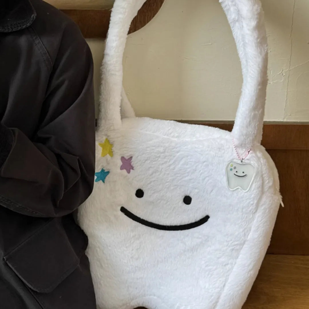 White plush shoulder tote bag with cute tooth pattern design and front zipper opening