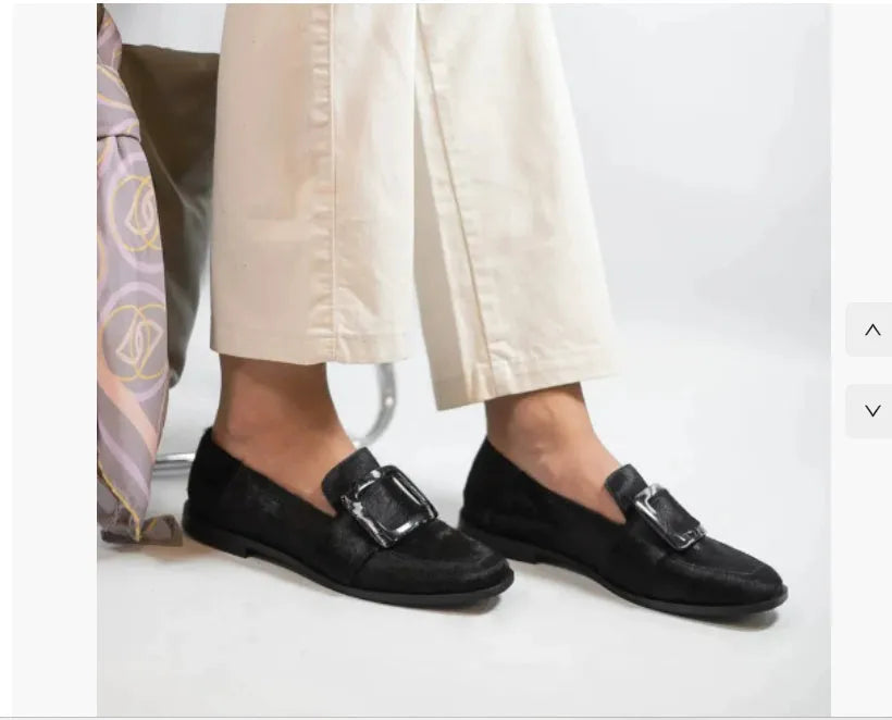 Low-cut black loafers for women with large square button and rhinestone details, round toe, low heel