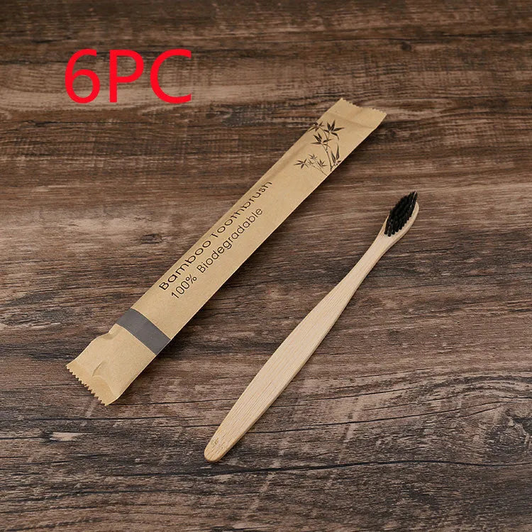 10 bamboo toothbrushes with soft charcoal bristles in assorted colours arranged fanned out