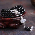 Natural black agate 108 beads bracelet on a flat surface, geometric beads, unisex fashion OL style