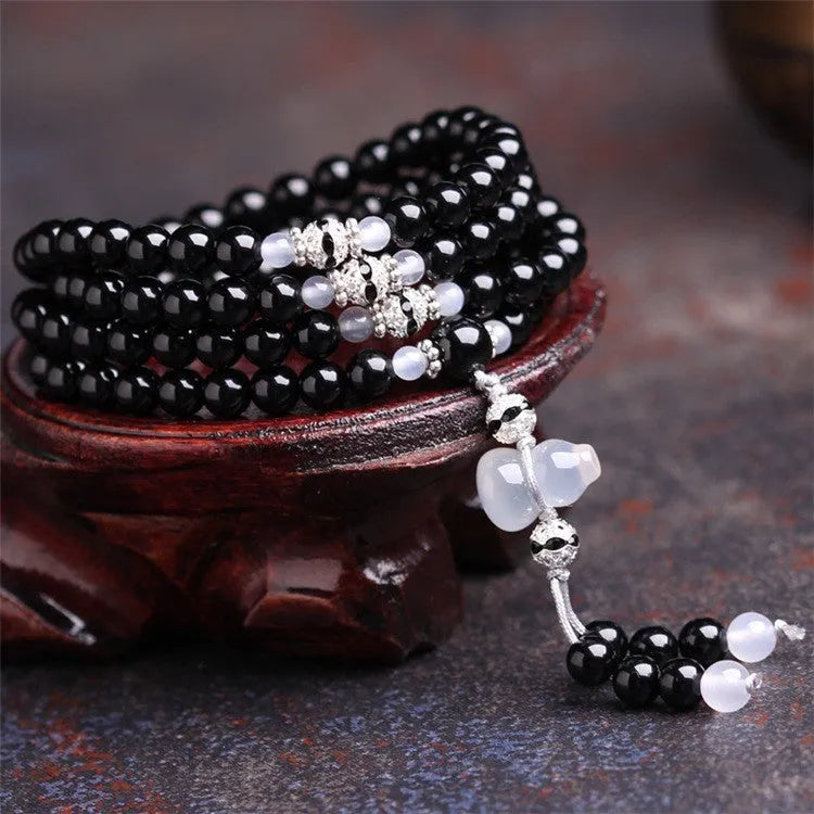 Natural black agate 108 beads bracelet on a flat surface, geometric beads, unisex fashion OL style