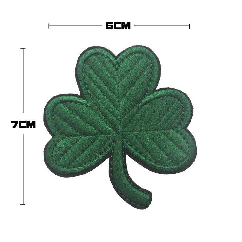 Embroidered fabric tactical badge with velcro backing showing military-inspired designs in green and black colours