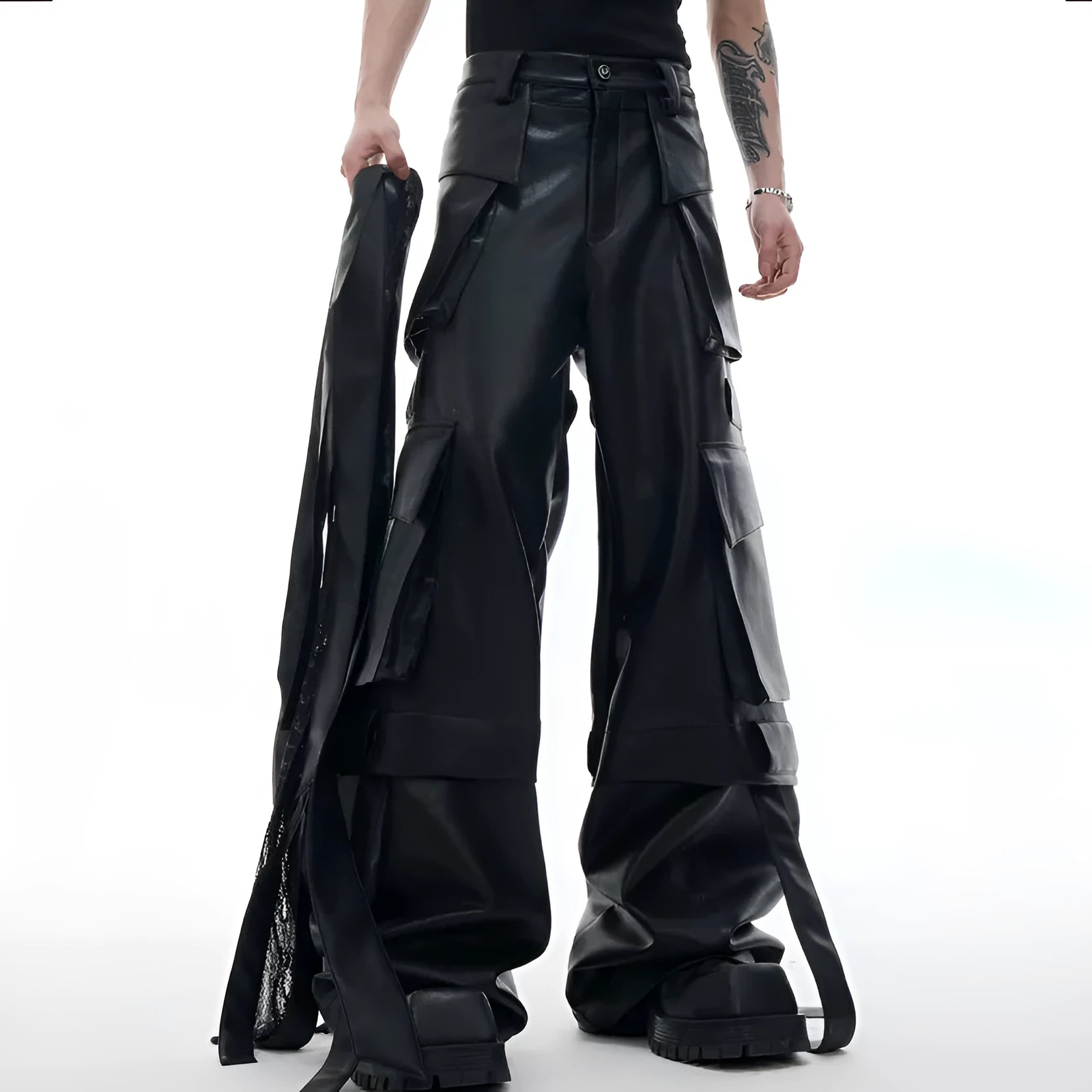 Black men's retro multi-pocket leather trousers with quilted stitching and loose fit.