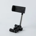 ABS and metal car rearview mirror phone holder with 360 rotation and snap buckle, holding a smartphone in place