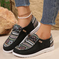 Women's low-top flat shoe in black with round toe and rubber sole, shown as an overshoe cover.