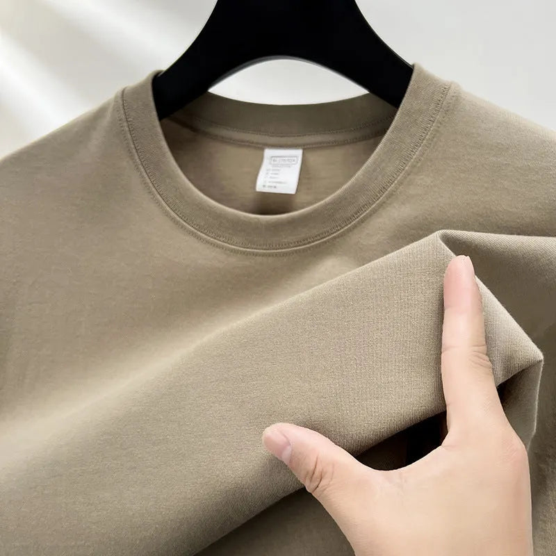 Men's drop shoulder solid colour cotton T-shirt in white, front view, short sleeves, relaxed fit