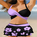 Women's black lace-up bikini with a matching high-waisted split skirt.
