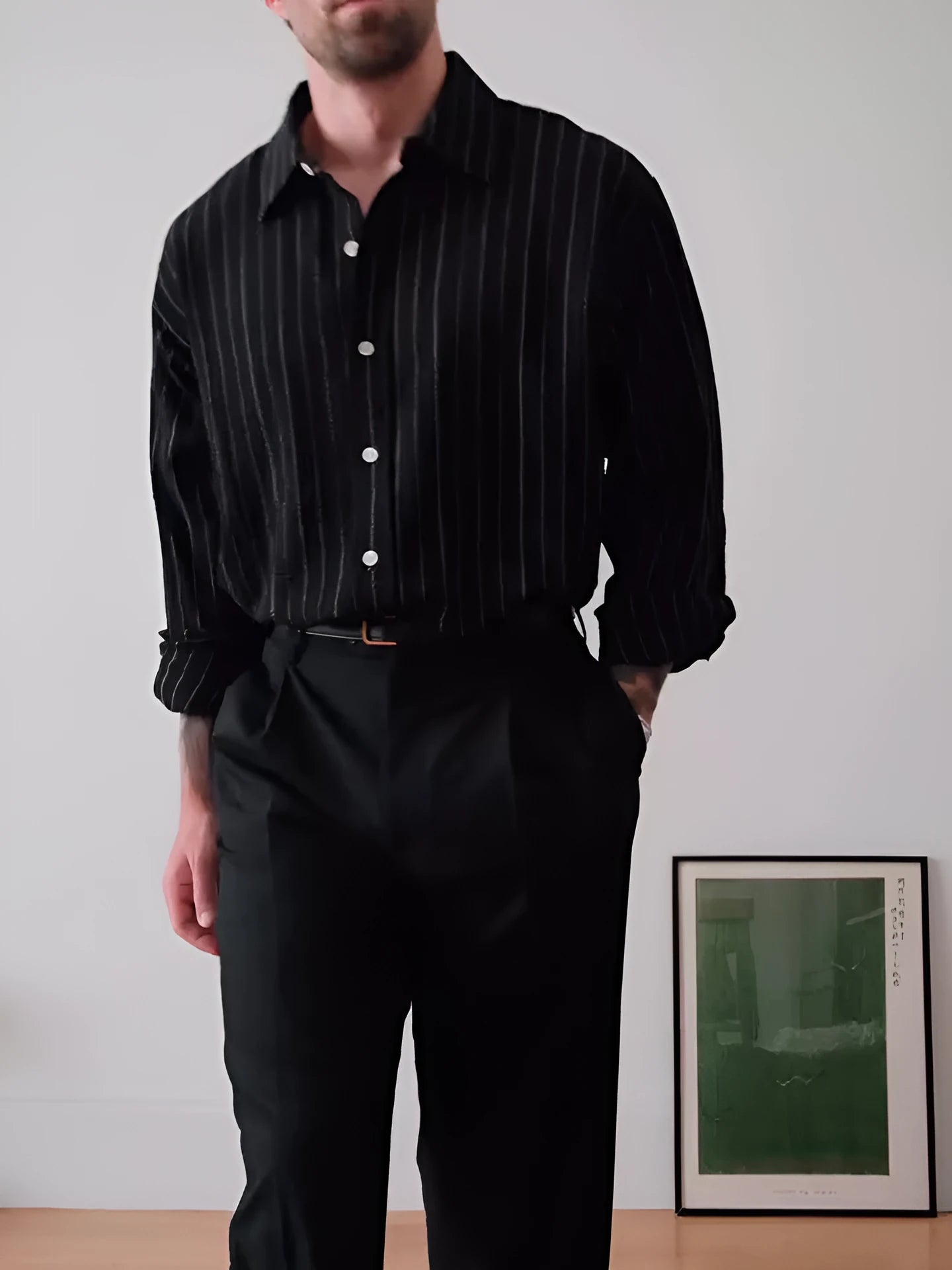 Black pinstriped button-down shirt with regular fit and striped pattern on polyester fabric