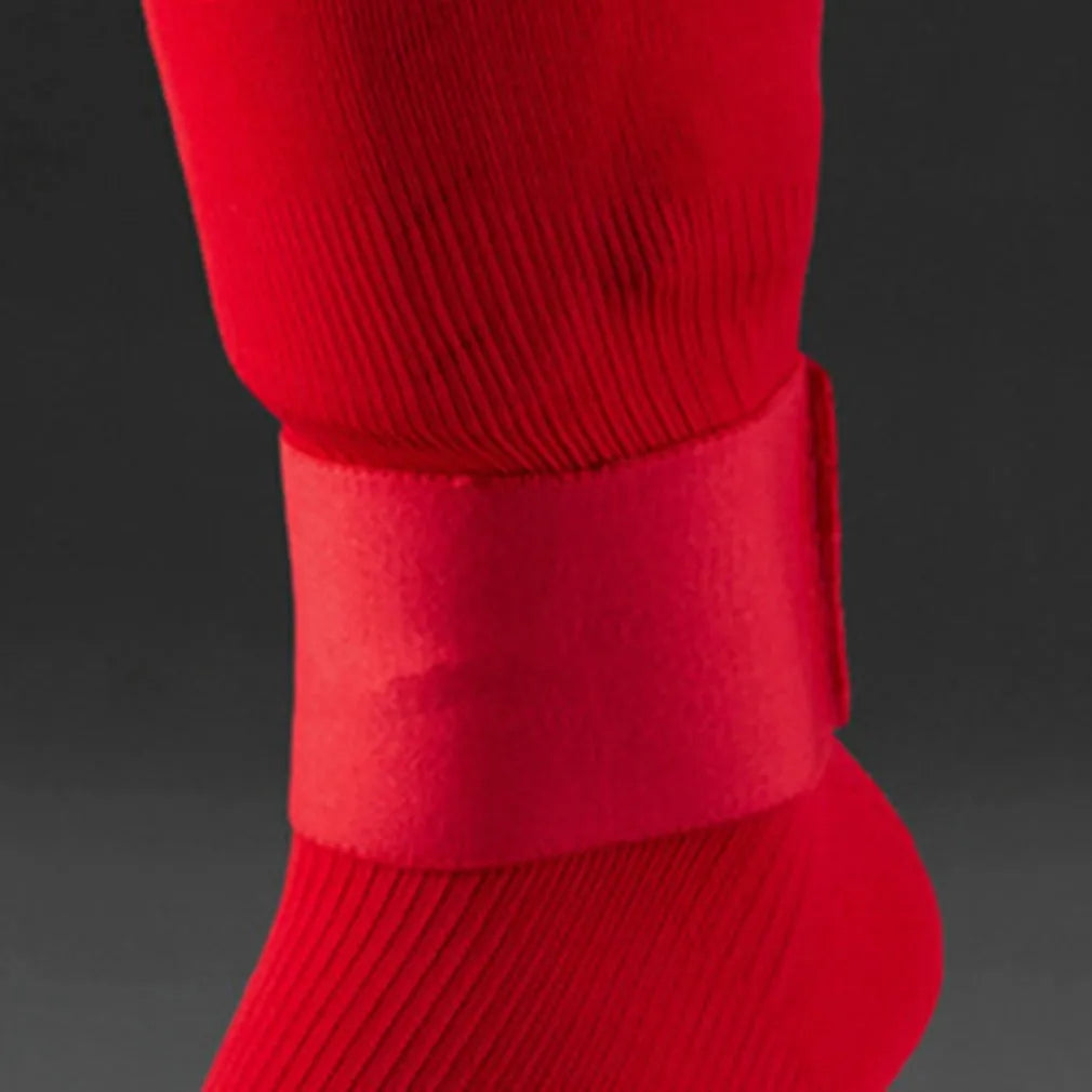 Red elastic rubber football shin guard fastening belt, approximately 25cm long.