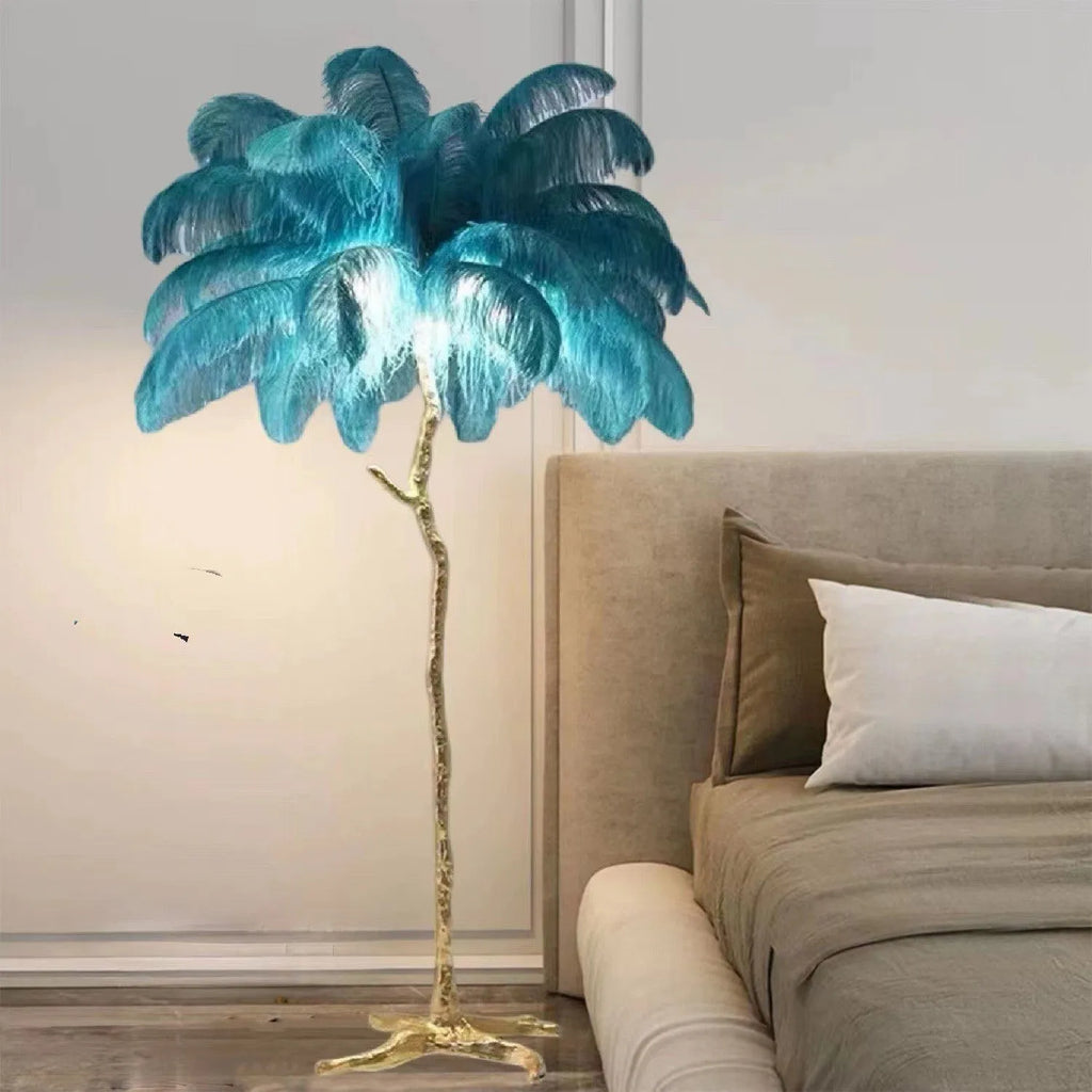Tall white resin feather floor lamp standing in a modern living room.