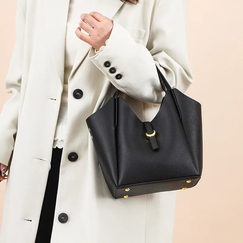 Genuine leather women's bucket handbag in European American retro style with hand holding design