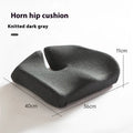 Memory foam office chair cushion in a solid colour, shown on a desk chair for scale.