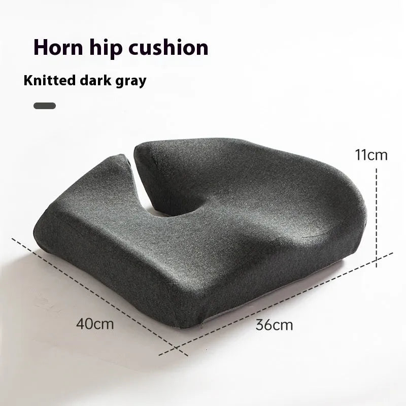 Memory foam office chair cushion in a solid colour, shown on a desk chair for scale.