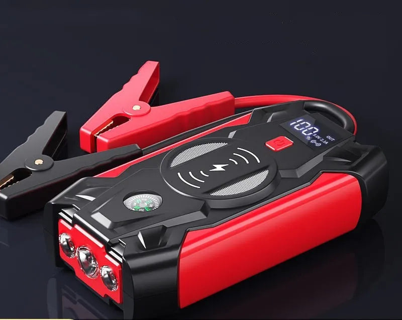 Red car emergency jump starter power bank with digital display and heavy-duty battery clips