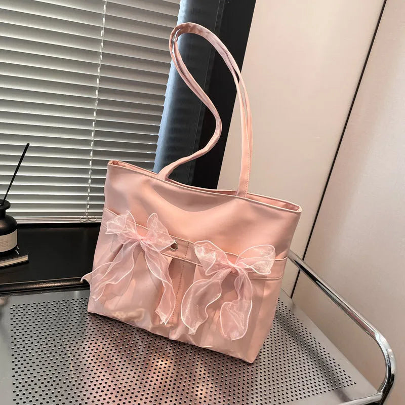 College style bow tote bag in black with large capacity, double shoulder straps, and zipper closure
