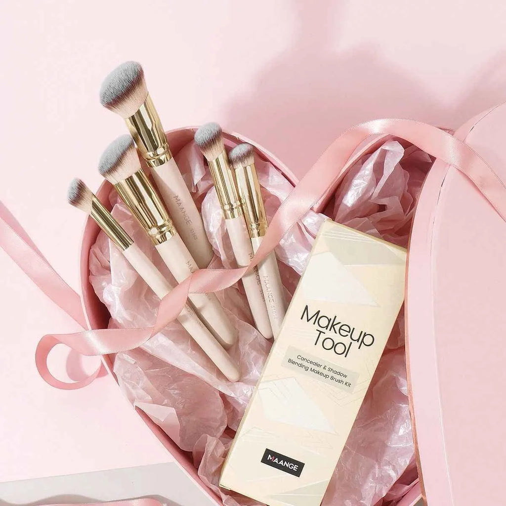 MAANGE set of five apricot-coloured makeup brushes with angled blusher brush on a white background.