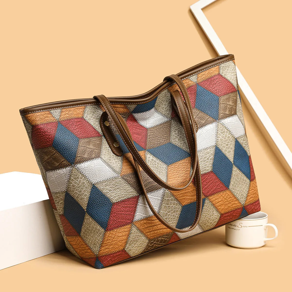 Women's PVC shoulder handbag with sandwich pocket design in blue brown colour