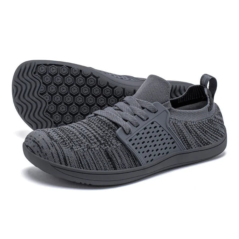 Men's casual walking shoes with synthetic leather upper, mesh panels, wide toe box, and lace-up closure