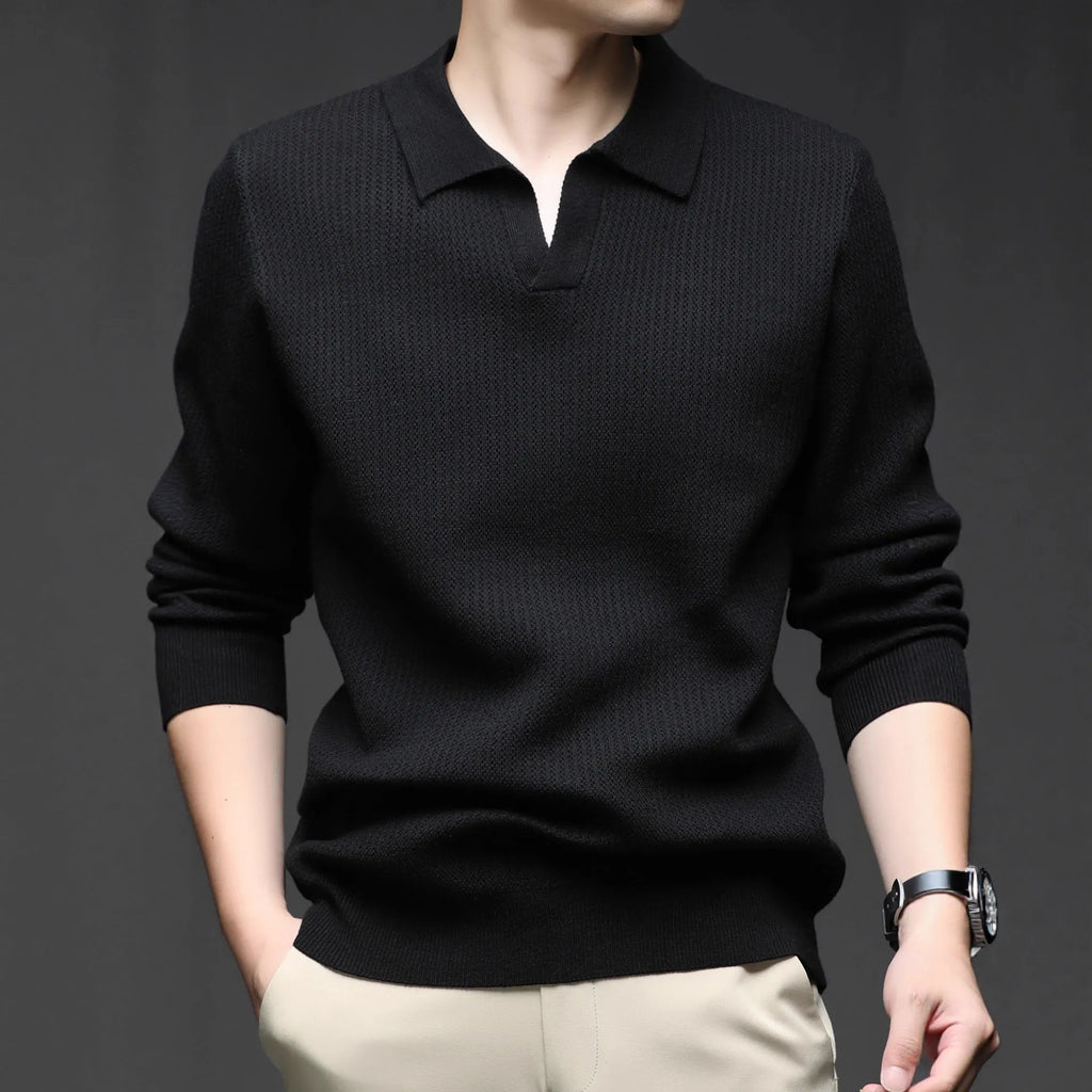 Man wearing a loose green casual pullover sweater for autumn.