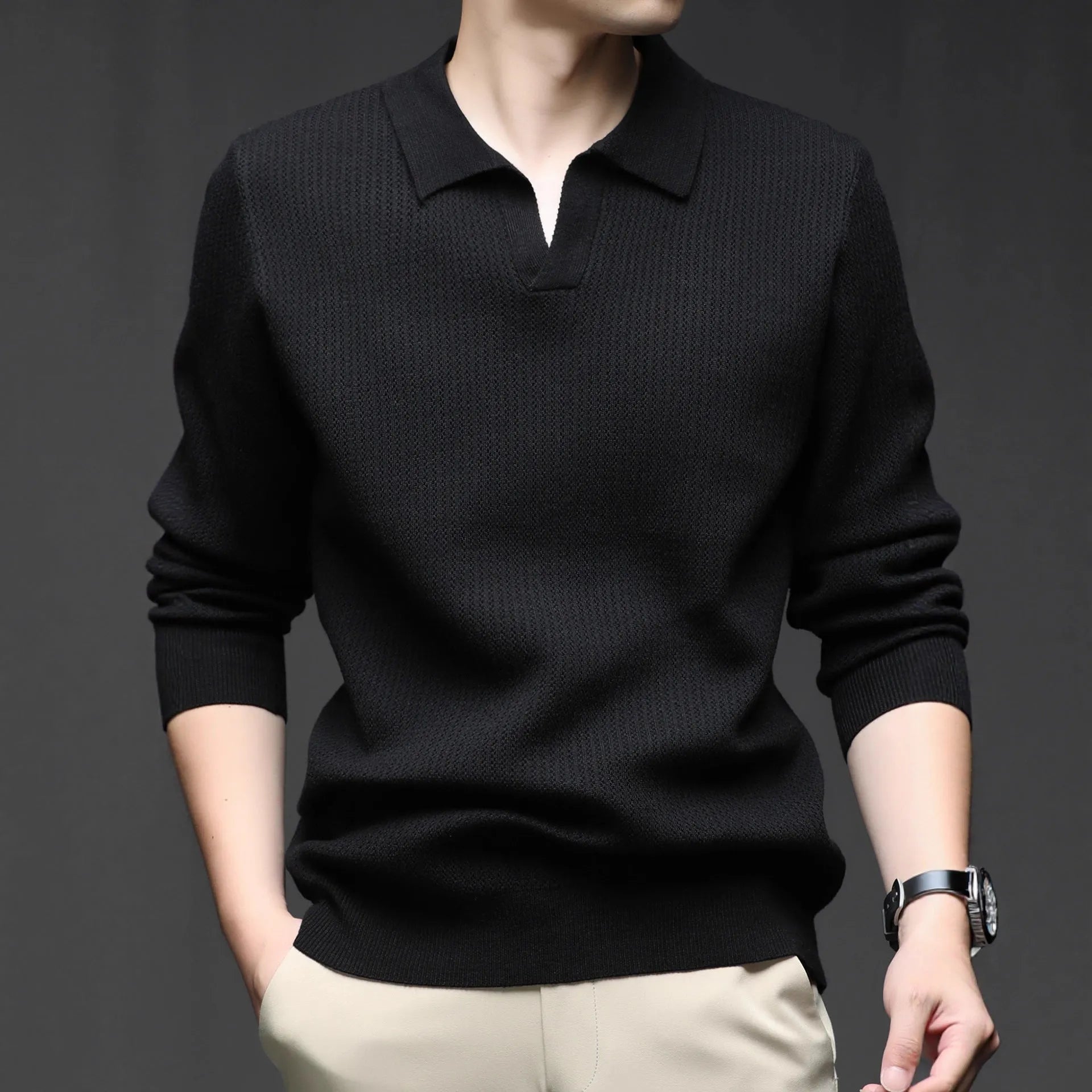 Man wearing a loose green casual pullover sweater for autumn.