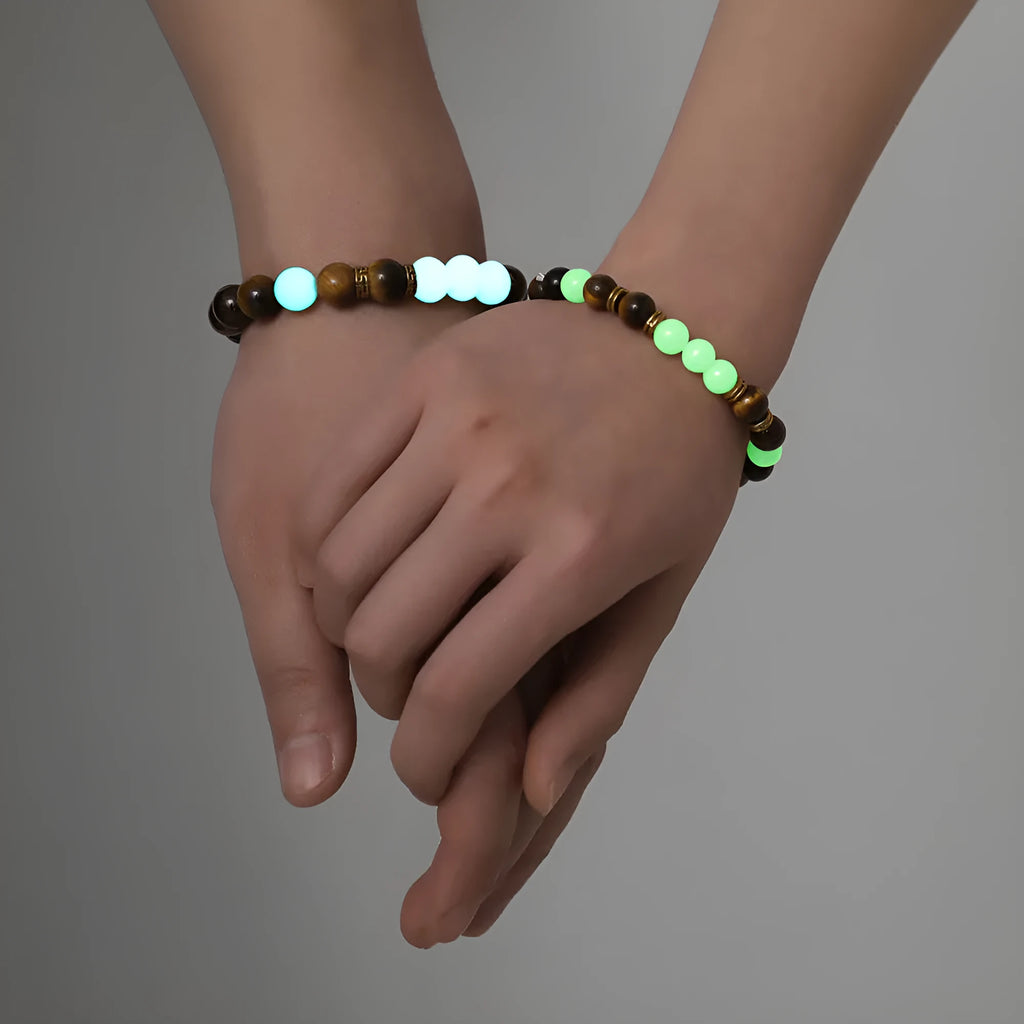 Pair of amber Y552 geometric luminous couple bracelets with patterned surface