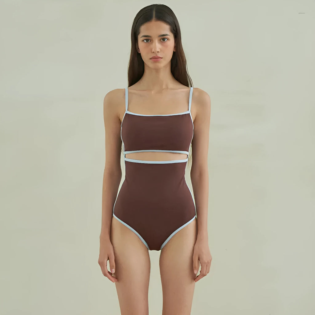 Brown women's one-piece triangle swimsuit on a hanger, showing front design.