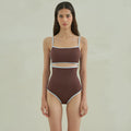 Brown women's one-piece triangle swimsuit on a hanger, showing front design.