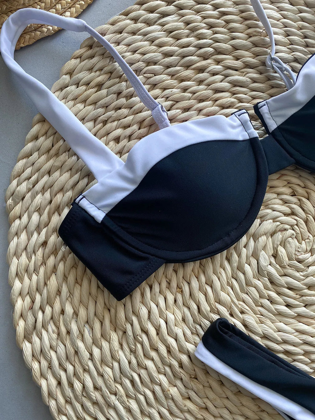 Women's black nylon bikini set with stitching detail and briefs bottoms