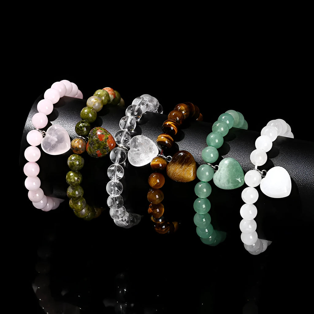 Natural stone love pendant hand bracelet with tigereye beads and geometric heart pendant on white background