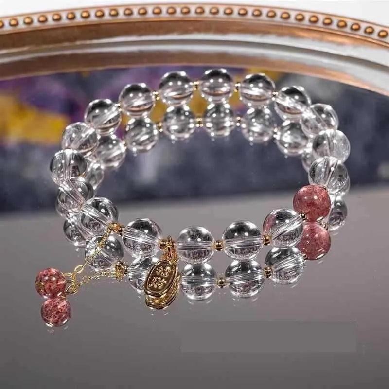 Natural white crystal lucky fortune bracelet with 8mm beads on a white background