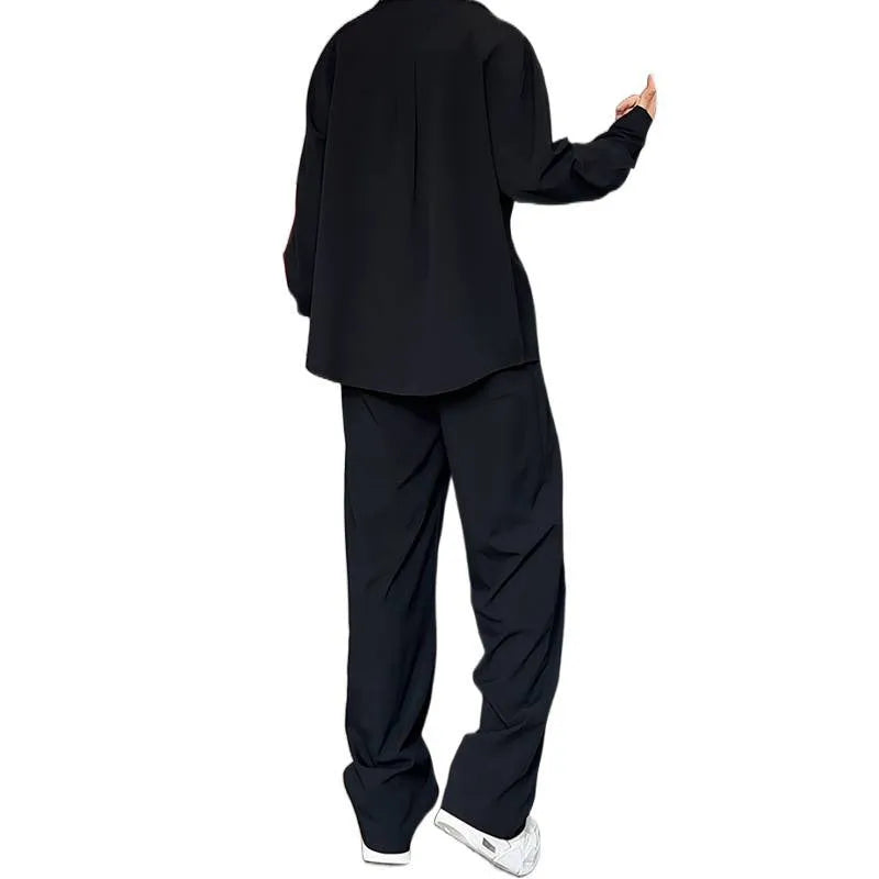 Man wearing a slim fit apricot long sleeve polo shirt and matching trousers from a casual two-piece suit set.