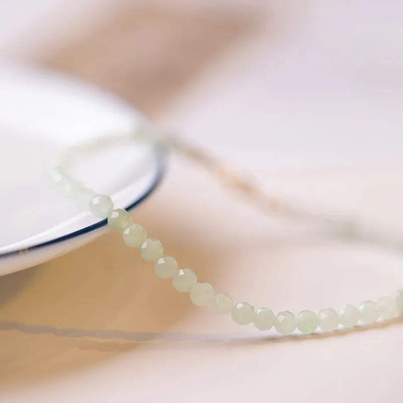 Women's Korean style retro bracelet with a jade ball charm on a chain.