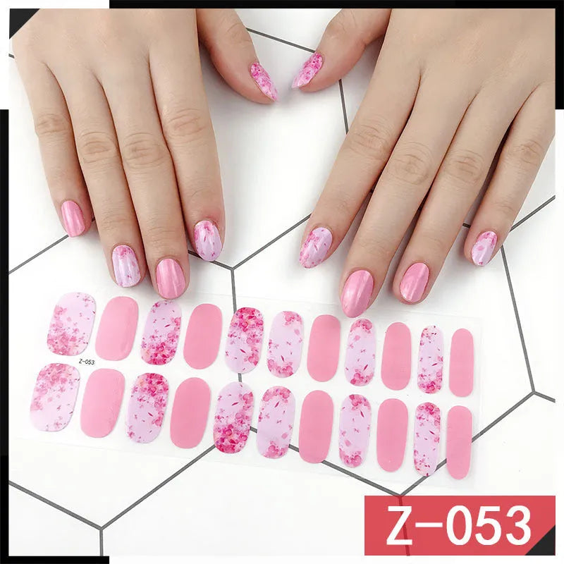 Korean nail stickers set with 22 pieces including cartoon, strawberry, flower, shell, and bow designs, plus a nail file.