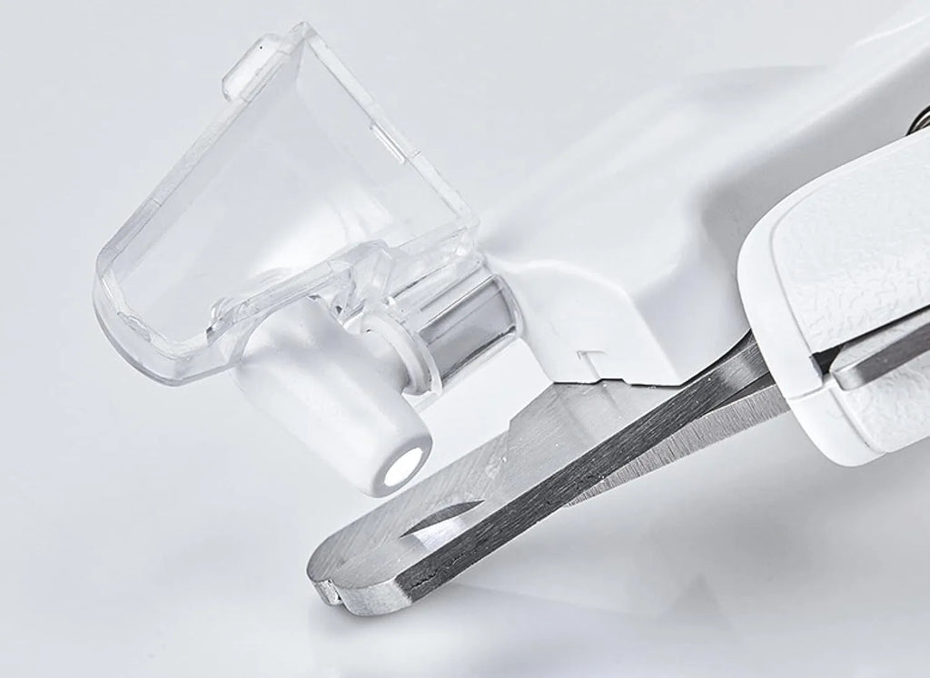 White pet nail clippers with LED light, triangular blade, and transparent anti-splash guard