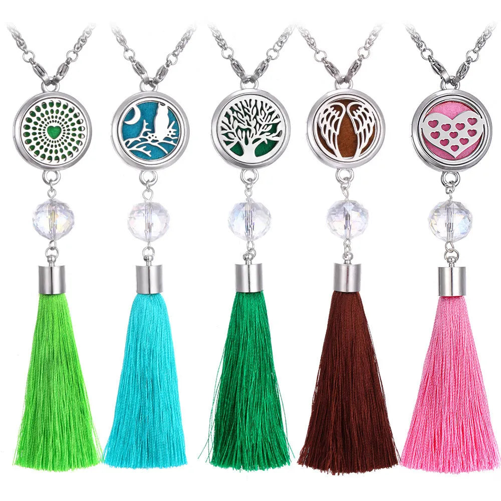 Silver alloy tassel aromatherapy car pendant with long chain on a coloured background.