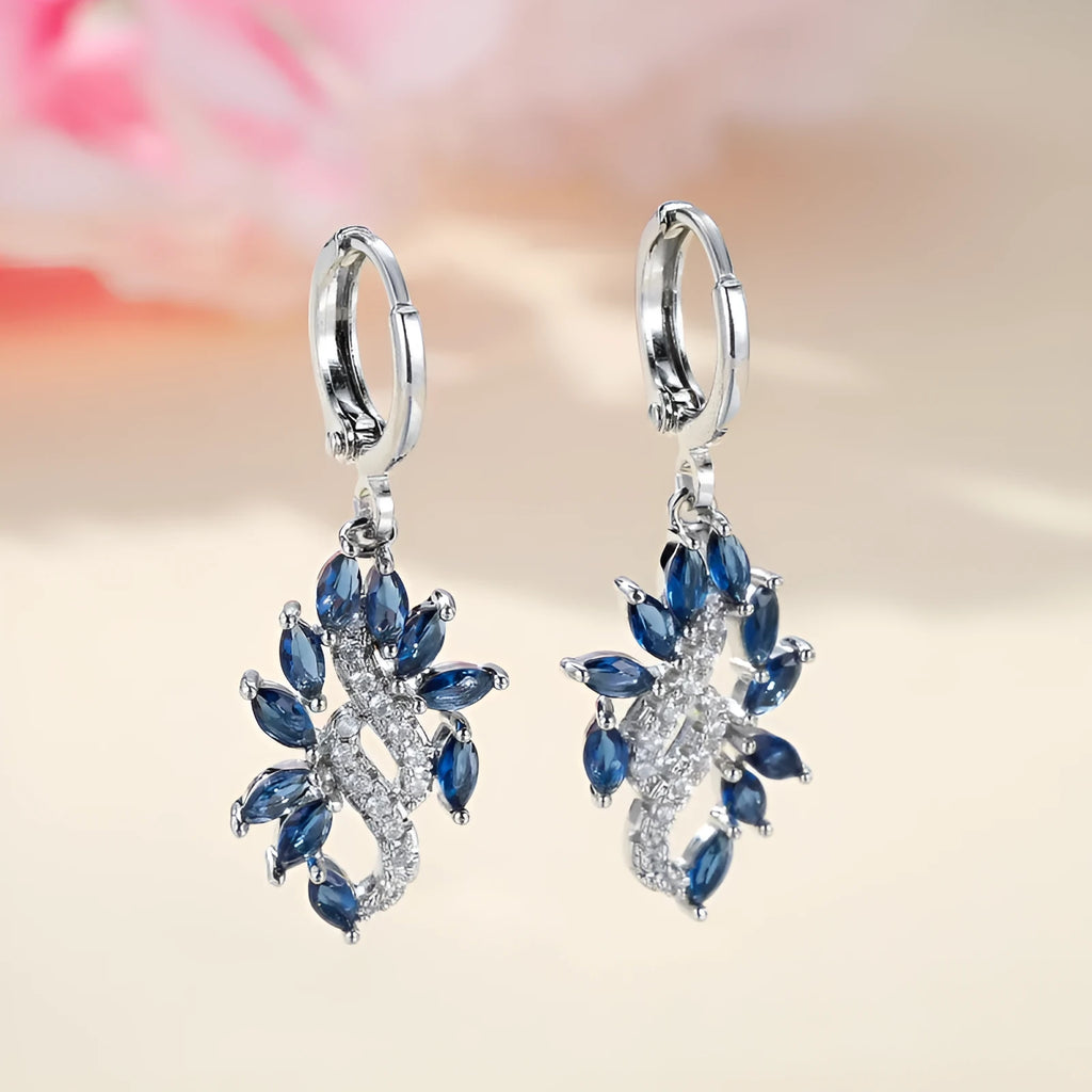 Women's simple minority all-match earrings in platinum sapphire blue alloy on display