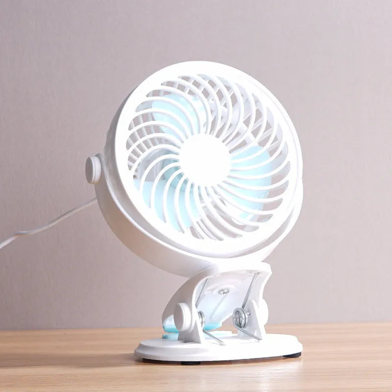 USB desk fan shown as both clip-mounted and floor-standing versions with three blades and mechanical dial control