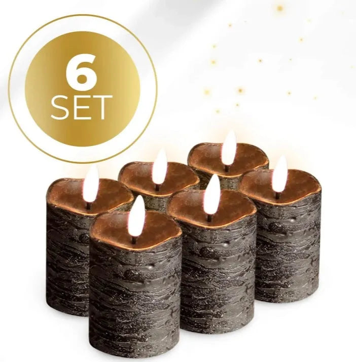 Set of four matte black LED pillar candles emitting a soft warm white glow.