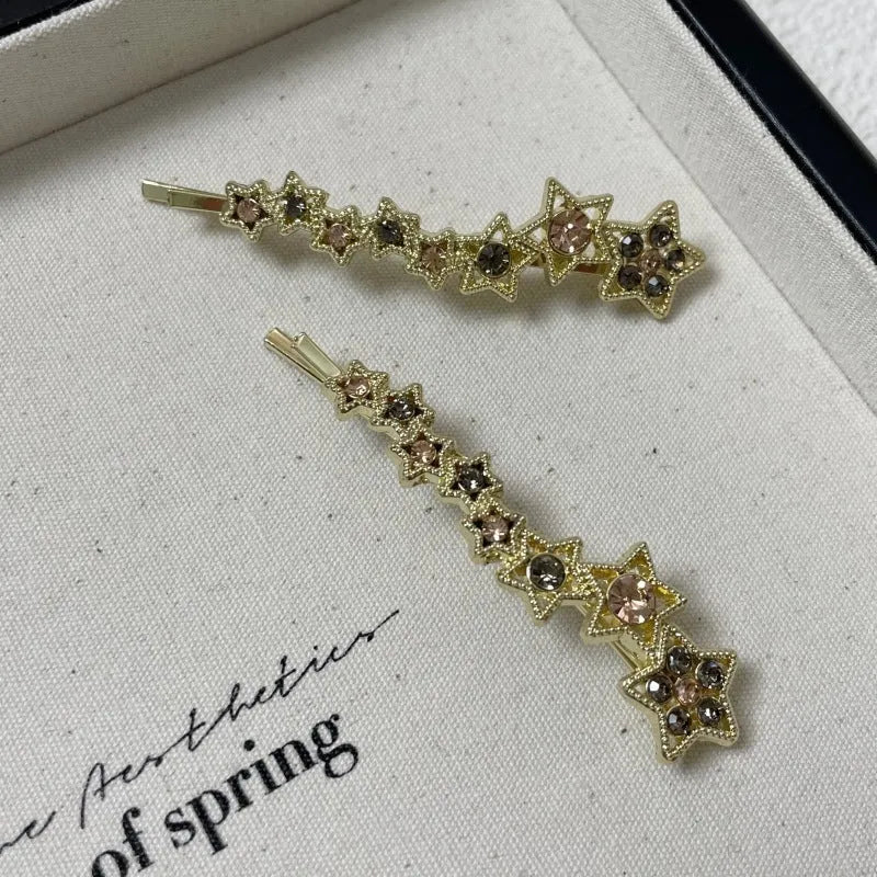 Gold electroplated alloy barrette clip with five-pointed star rhinestone design for bangs and hair sections