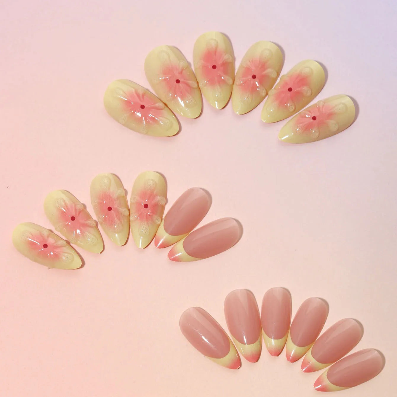 Detachable fake nails with pink 3D cartoon flowers, jelly glue, and filing strip on white background