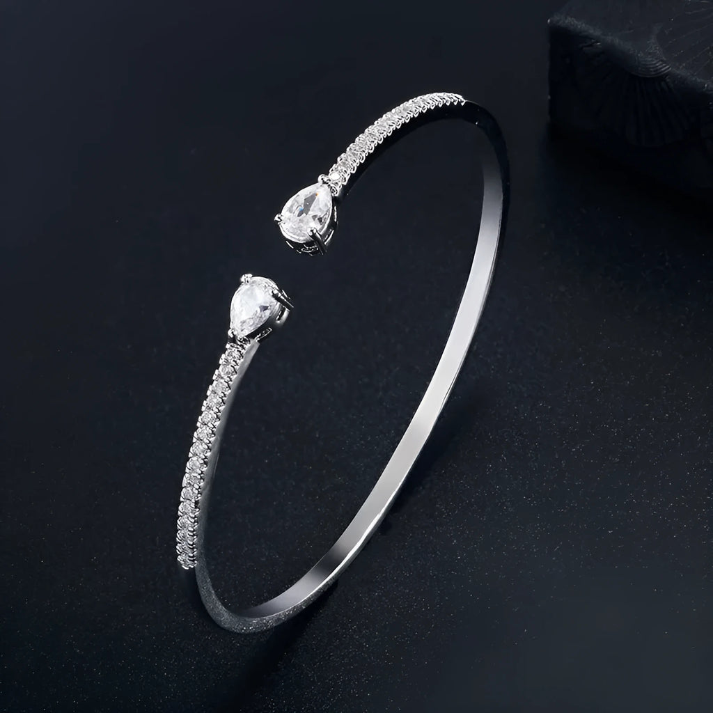 Copper bracelet with multi-zircon inlay in blue or white colour options