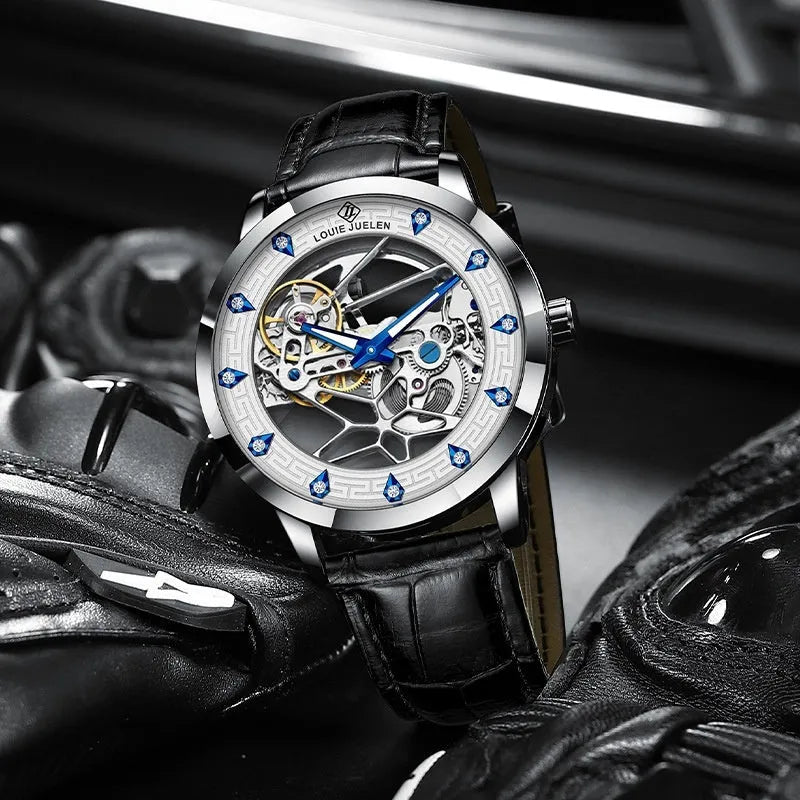 Men's silver case mechanical watch with white dial, blue hands, black leather strap and waterproof construction